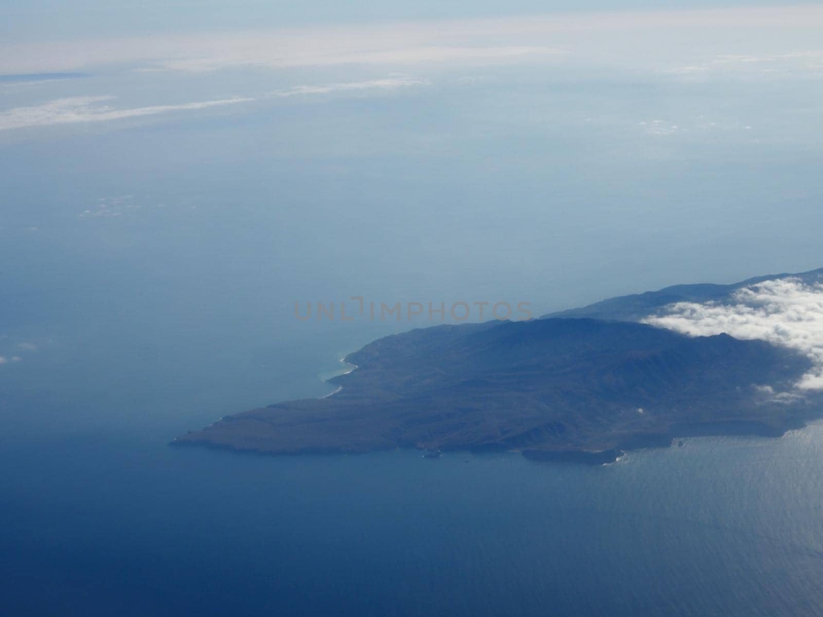 Aerial of Santa Cruz Island.  Santa Cruz Island is located off the southwestern coast of California, United States. It is the largest island in California, and largest of the eight islands in the Channel Islands archipelago.