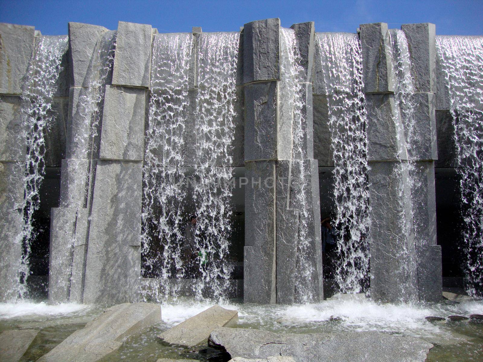 San Francisco - July 11, 2010:  Waterfall at Martin Luther King, Jr. Memorial at Yerba Buena Gardens.  The vision of peace and international unity is enshrined in this memorial featuring a majestic waterfall and shimmering glass panels inscribed with Dr. King’s inspiring words, poems and images from the civil rights movement. Artist and sculptor, Houston Conwill, created this memorial in collaboration with poet Estella Conwill Majoza and architect Joseph De Pace.                   