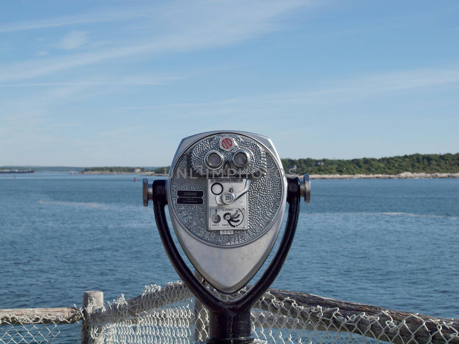 Portland, Maine -  May 28, 2010:  Coin operated binoculars look into the bay at Portland Head Lighthouse in Portland, Maine. 