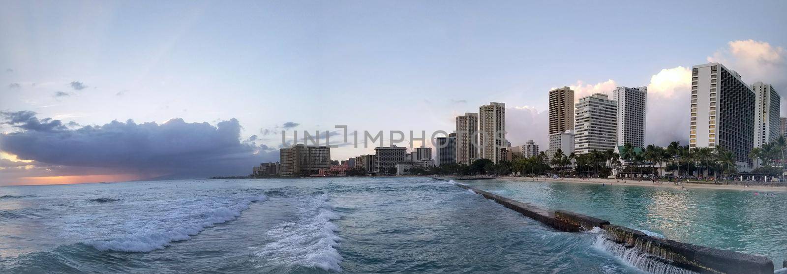 Panoramic of Waves rolling towards protected water of Waikiki beach by EricGBVD