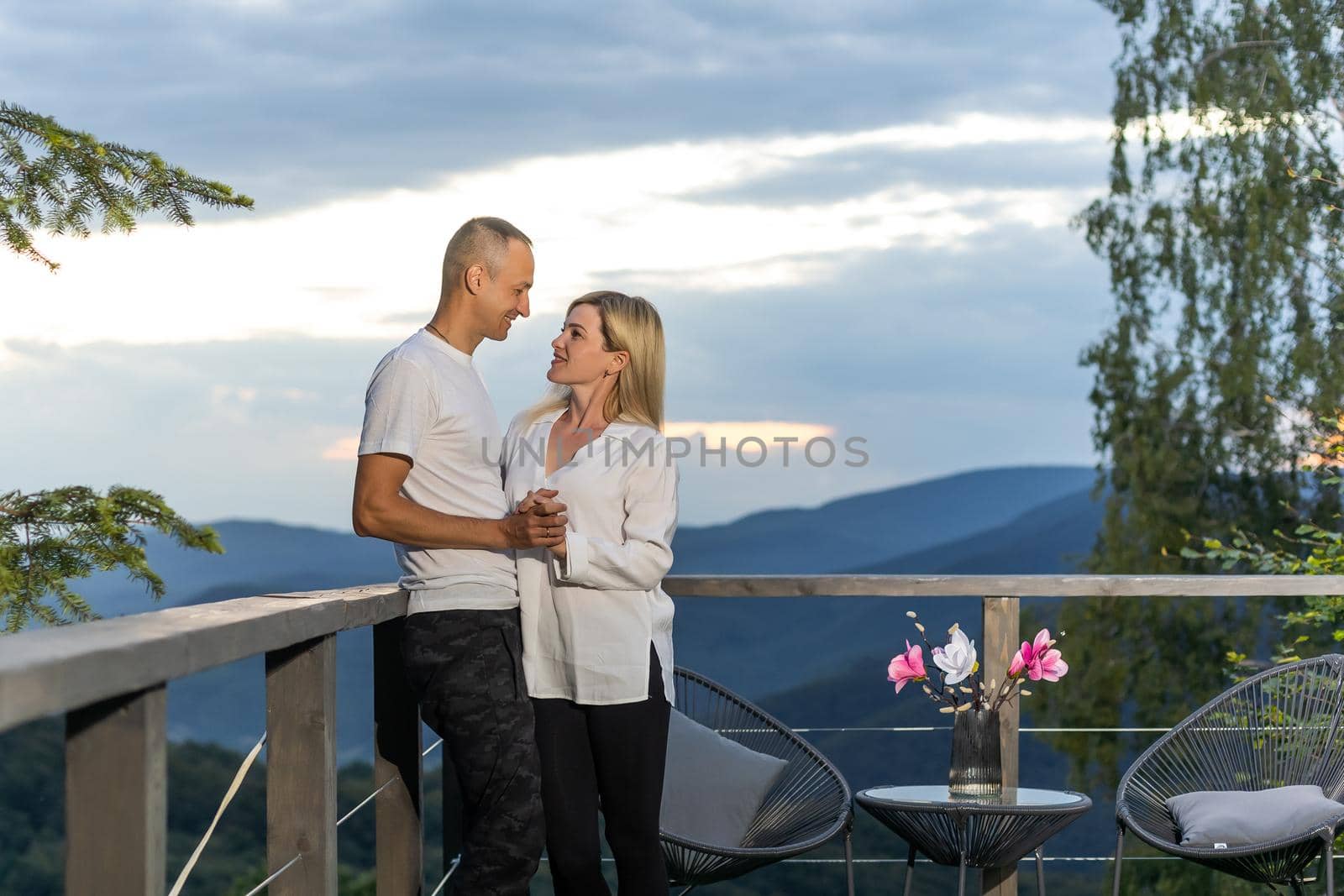 beautiful young couple enjoying nature at mountain.