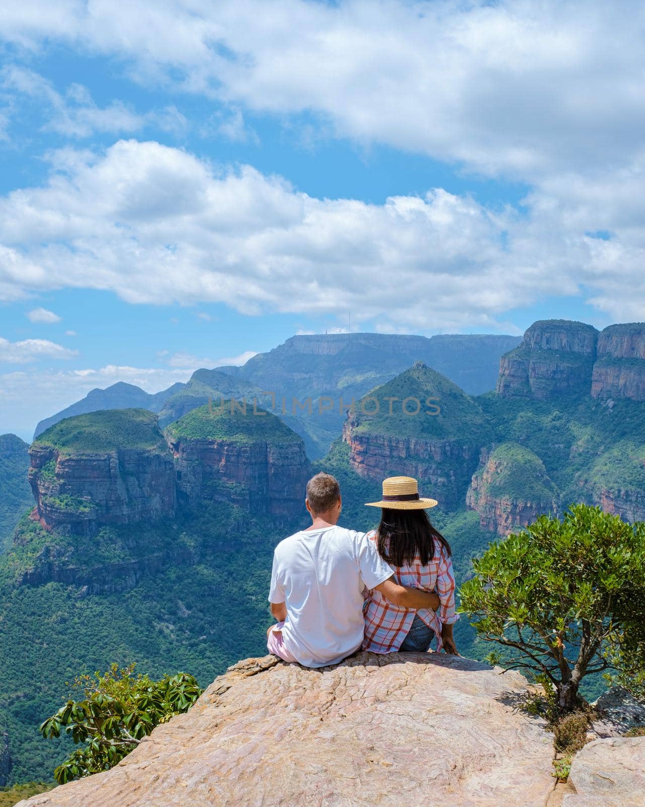 Panorama Route South Africa, Blyde river canyon with the three rondavels, view of three rondavels and the Blyde river canyon in South Africa. Asian women and Caucasian men on vacation in South Africa