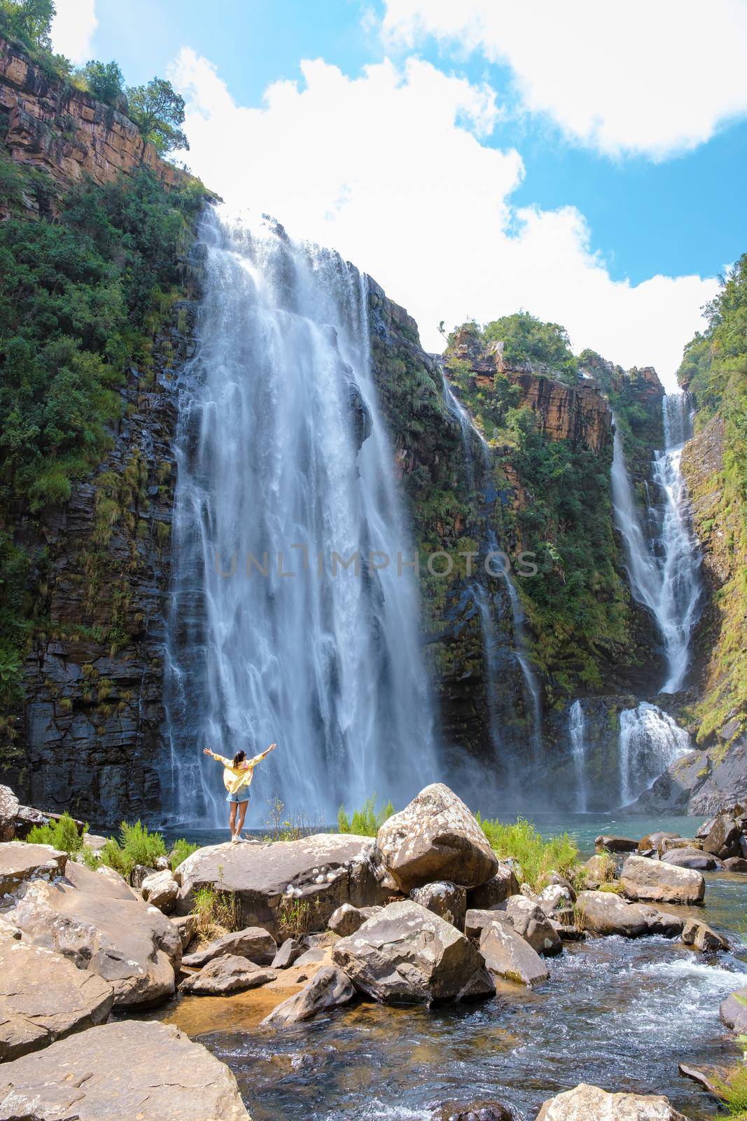Panorama Route South Africa, Lisbon Falls South Africa, Lisbon Falls is the highest waterfall in Mpumalanga, South Africa. Asian women on vacation in South Africa