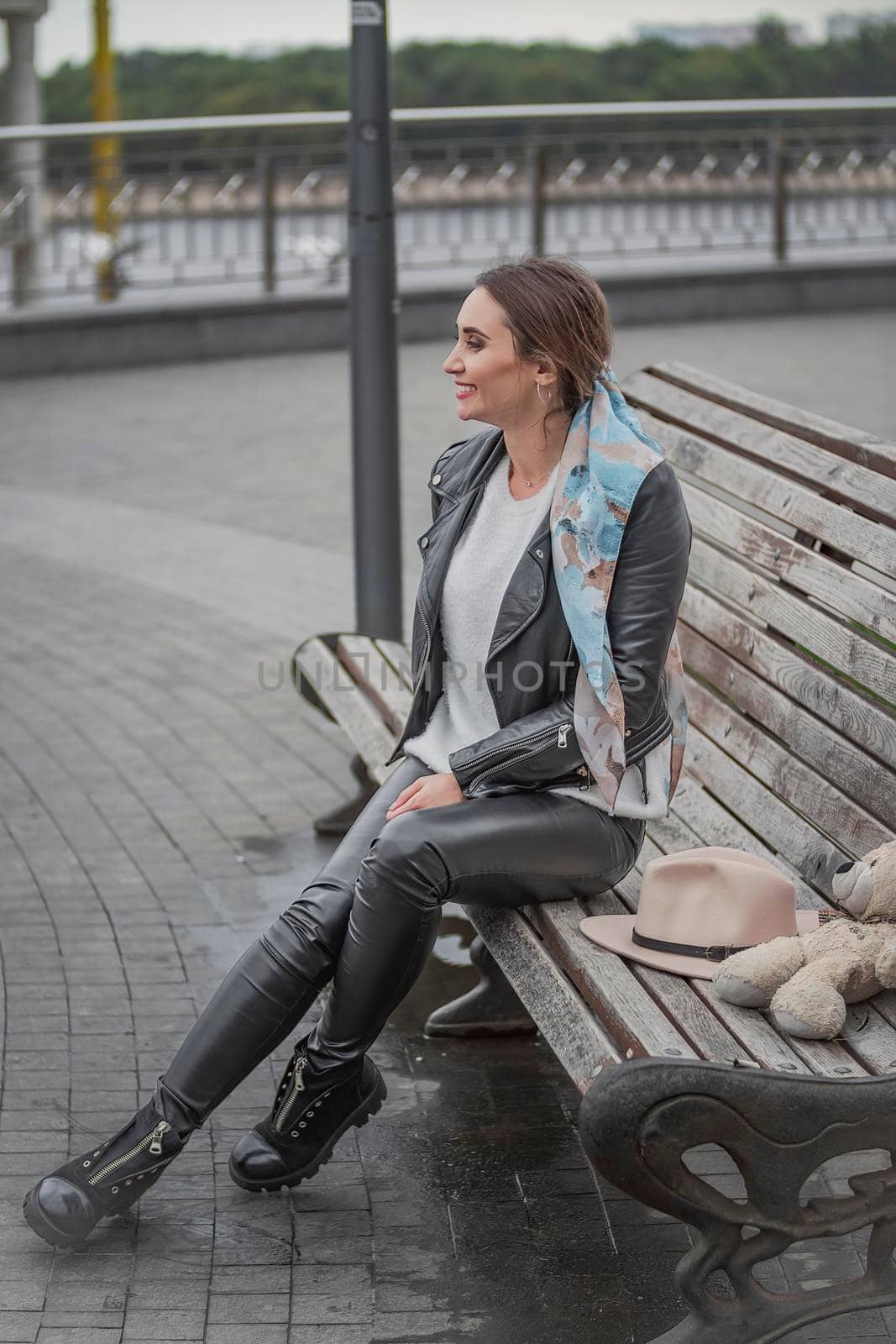 woman sitting on a bench by zokov