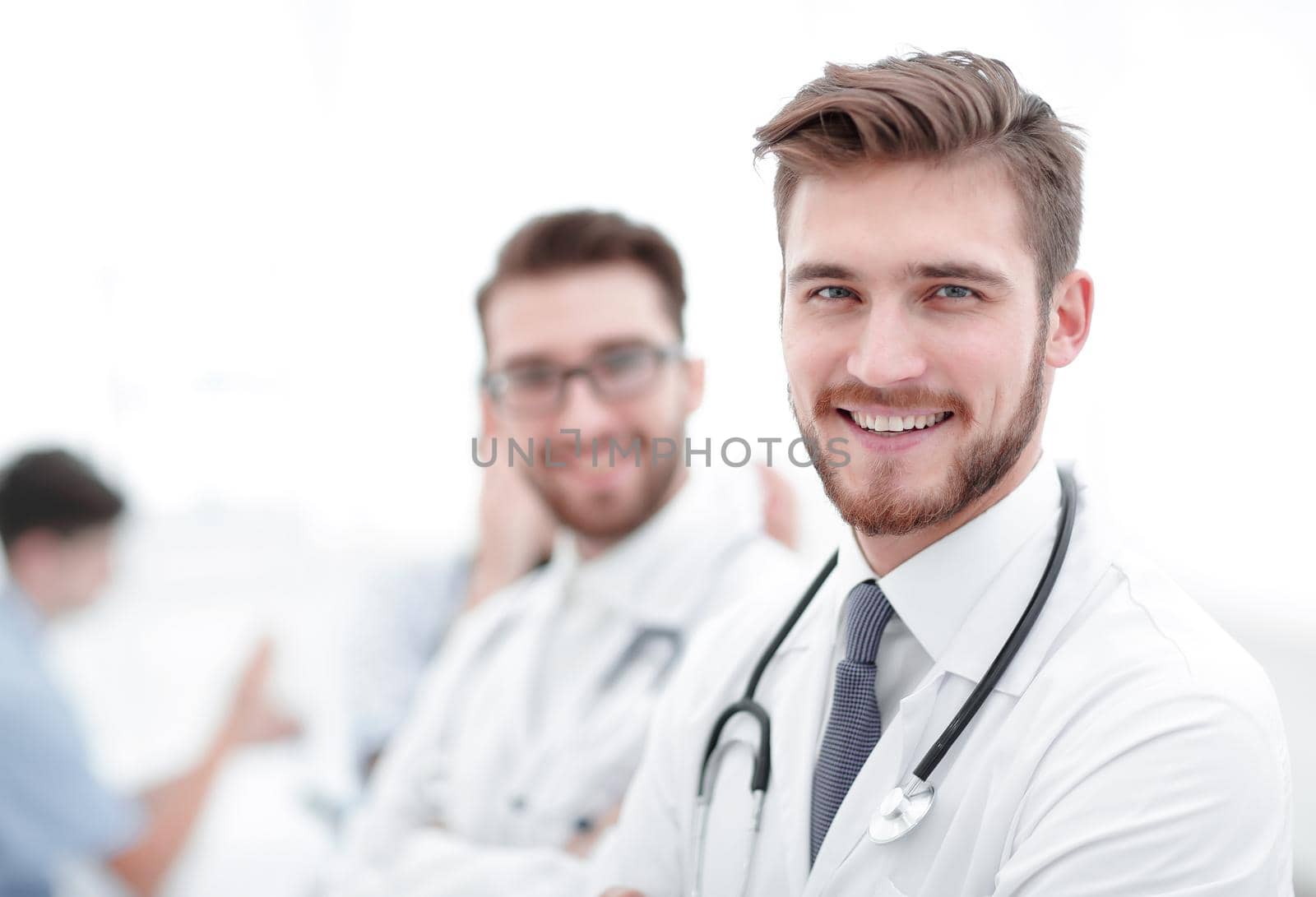 Portrait of friendly male doctor smiling by asdf