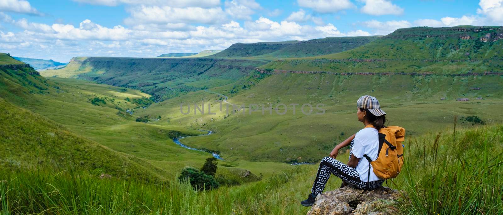 Young woman hiking in the mountains of Drakensberg South Africa by fokkebok