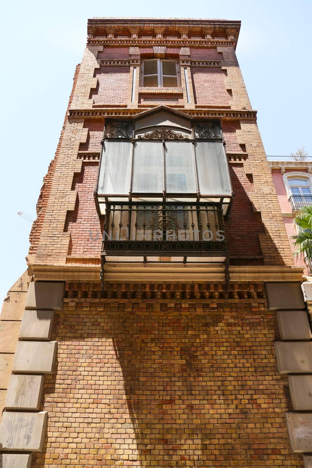 Old wooden balcony modernist style in Cartagena city, Murcia, Spain