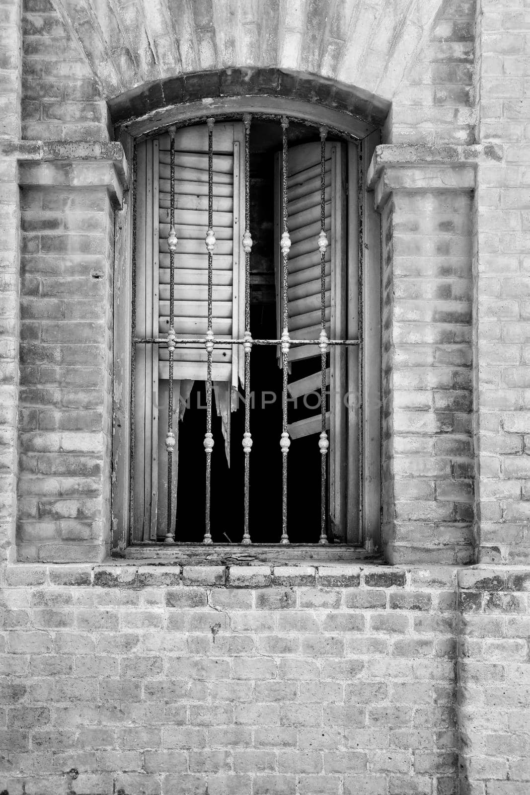 Broken and damaged window in an old house in Spain