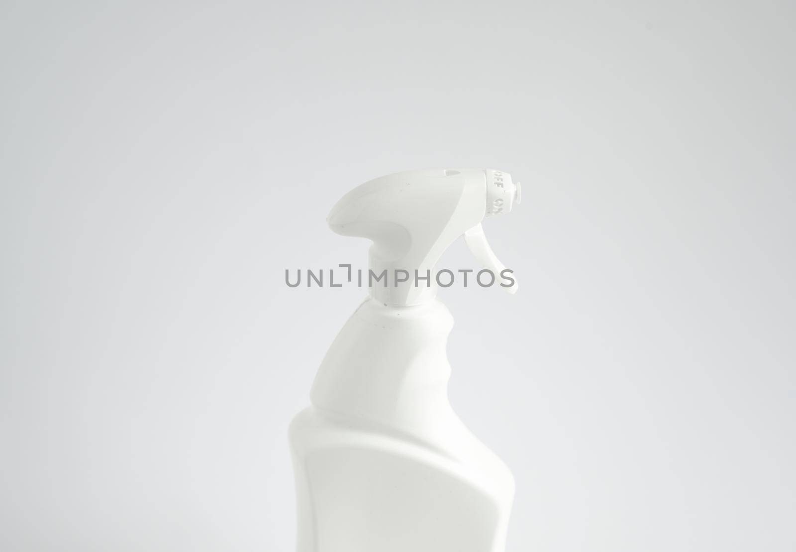 White plastic spray bottle for liquid cleaning products isolated on white background. Packaging mockup bottle with sprayer