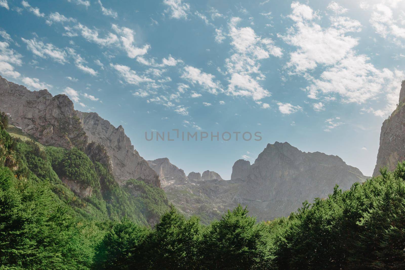 A view of the accursed mountains in the Grebaje Valley. Prokletije, also known as the Albanian Alps and the Accursed Mountains, is a mountain range on the Balkan peninsula, extending from northern Albania to Kosovo and eastern Montenegro. by Andrii_Ko