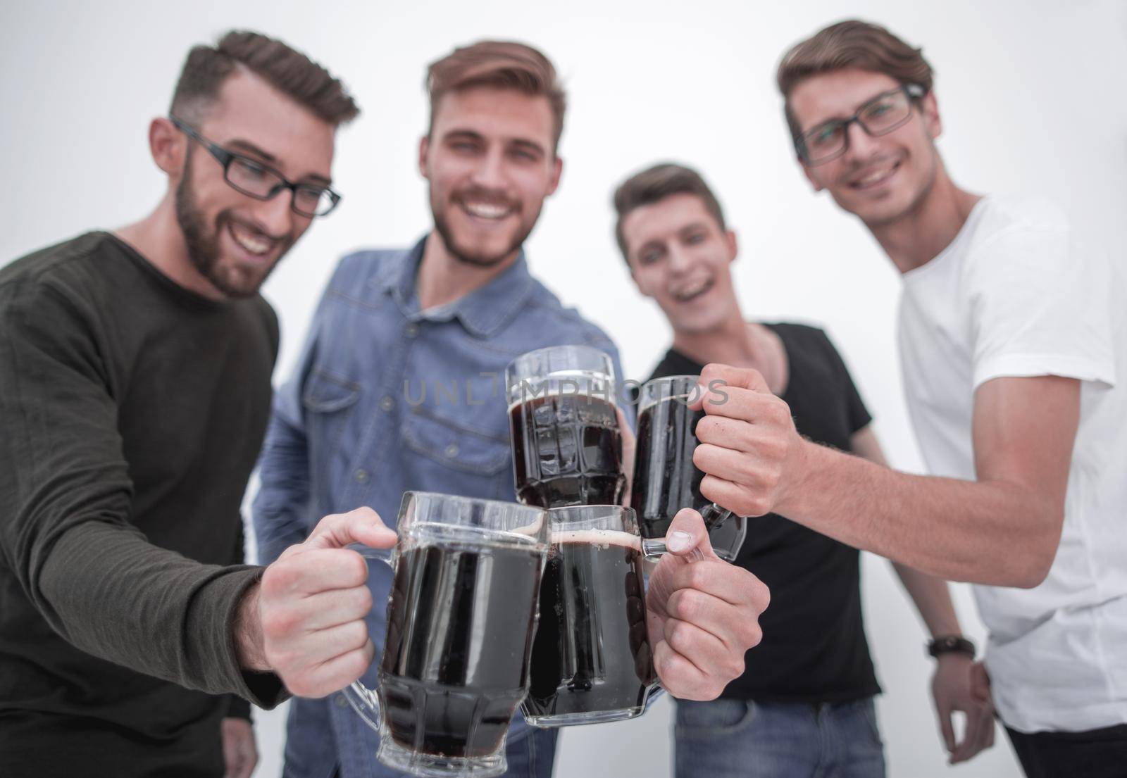 Joyful people holding big beer mug full of beer and looking at camera, isolated on white background
