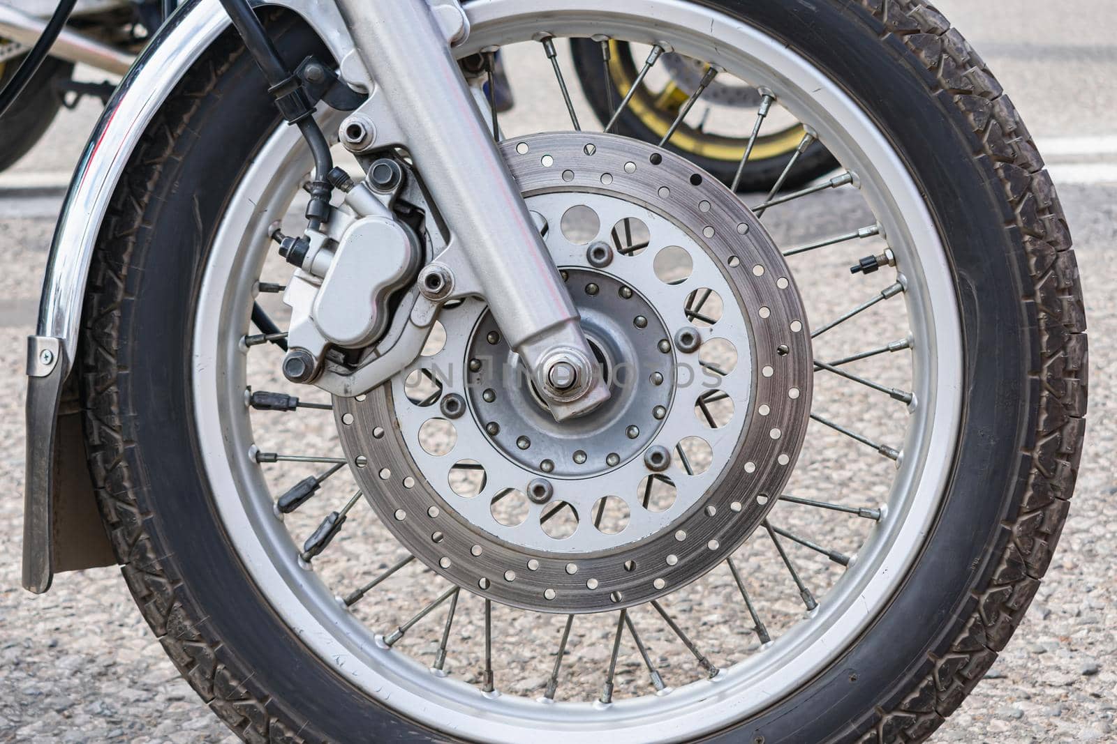 Close-up of the front wheel of a motorcycle by Skaron