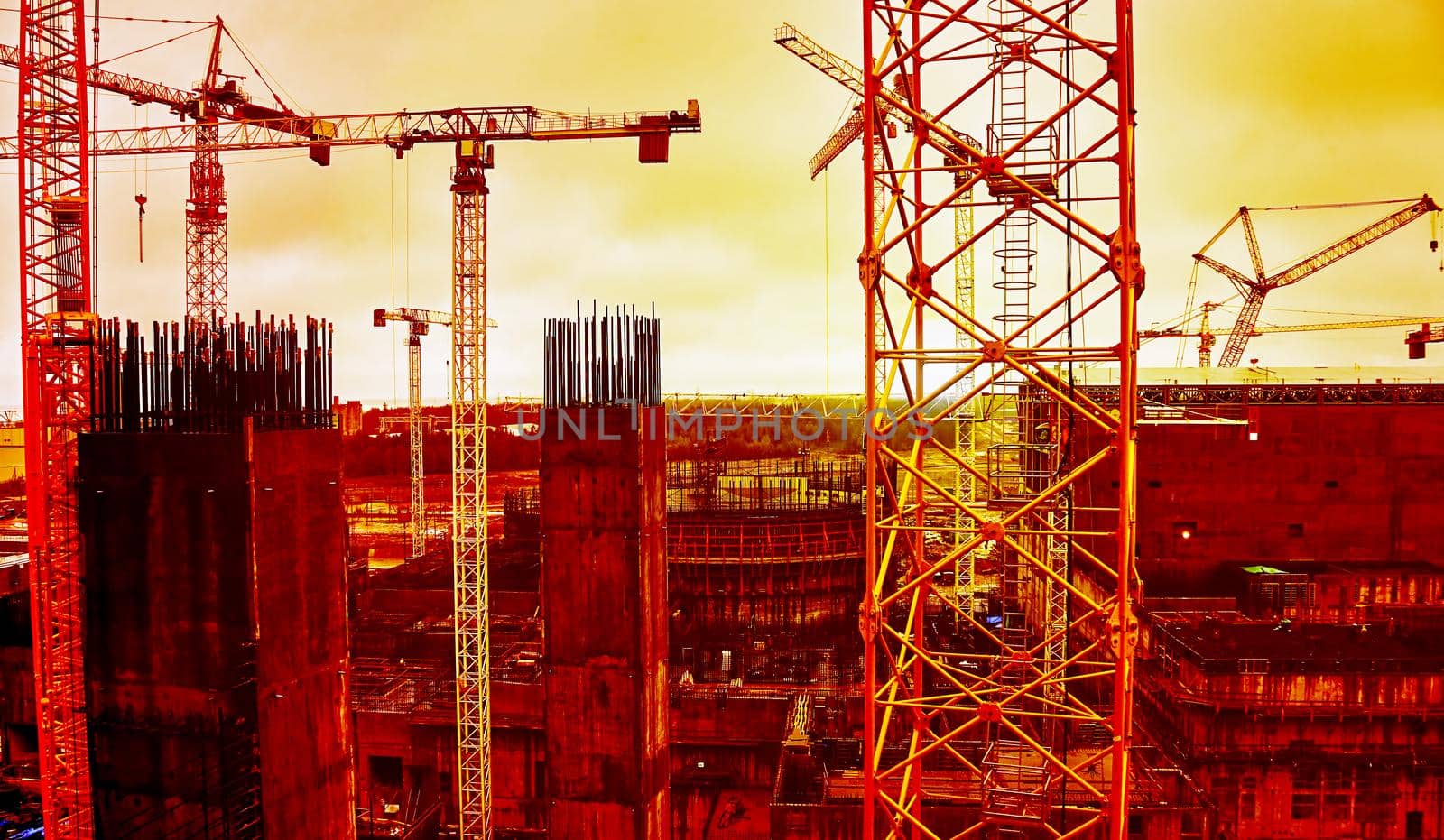 Cooling tower of an environmentally friendly nuclear power plant under construction and a lifting tower crane