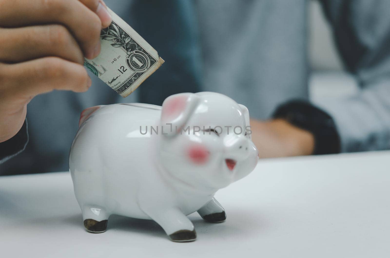 Man person holding dollar bank saving piggybank.Business finance investment economy and safe tax retirement concept. by aoo3771