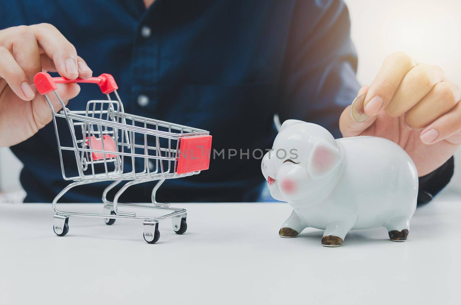 Savings retirement or investment business financial expenses marketing . businessman holding cart and piggy bank.