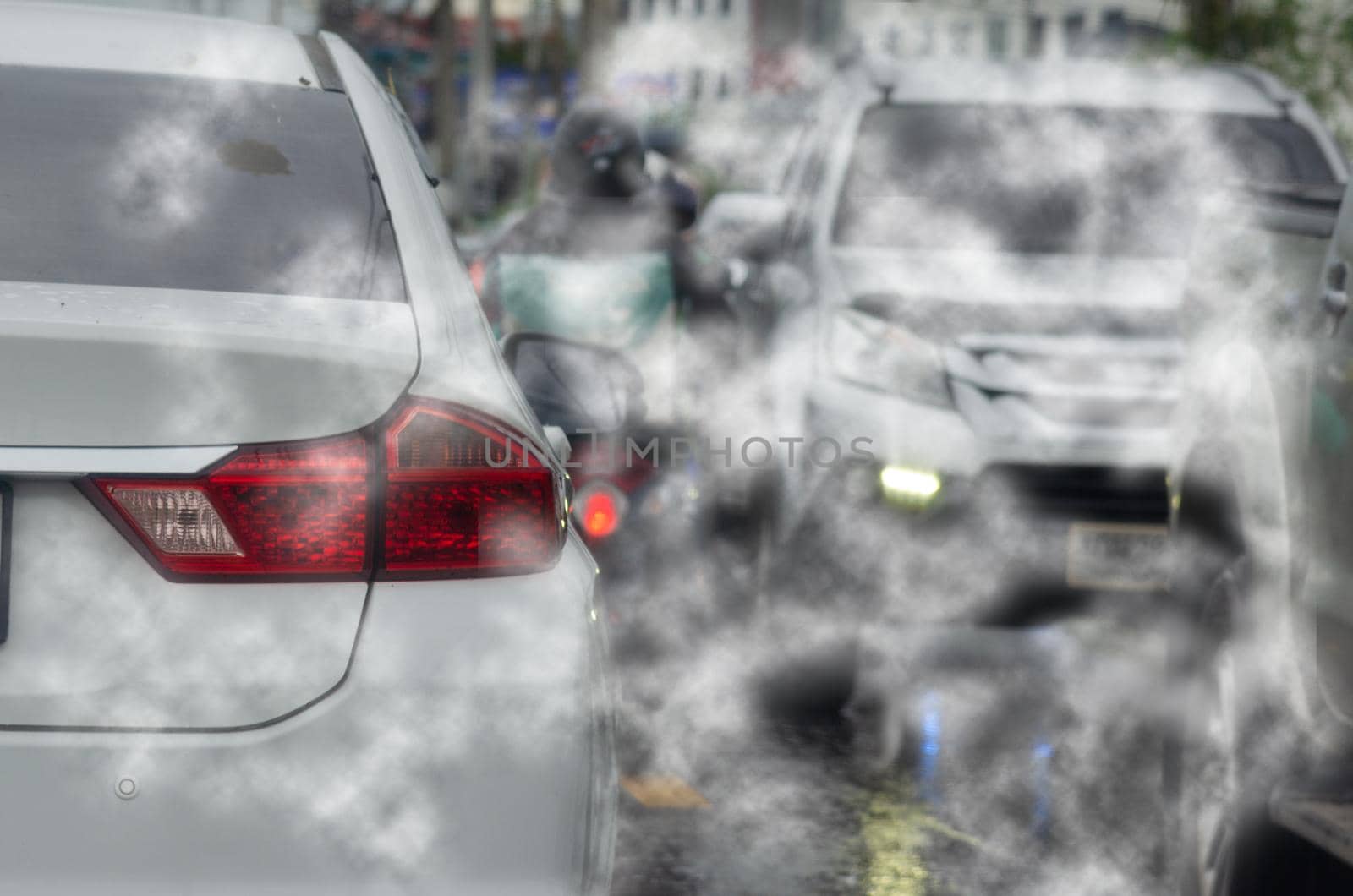 car pollution smoke exhaust automobile pollution traffic jam on road.Car emitting carbon dioxide causing air pollution. by aoo3771