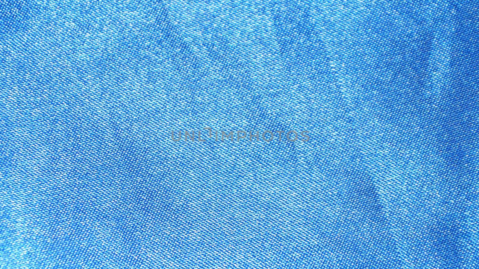 blue fabric texture for textile background close-up.
