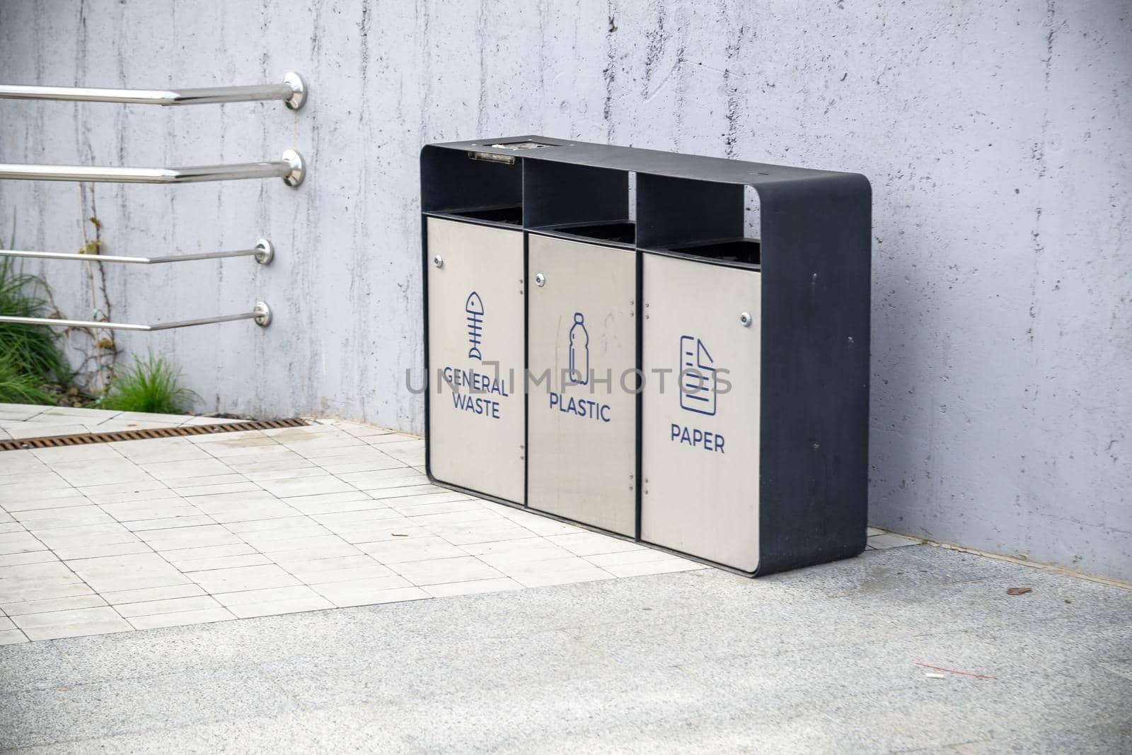 The three different container for sorting garbage. For plastic, paper, metal waste.