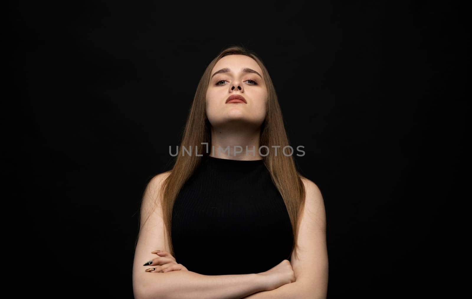 Negative human emotions and feelings. Grumpy young woman posing, frowning eyebrows, her look and grimace expressing anger, annoyance and dislike. by vovsht
