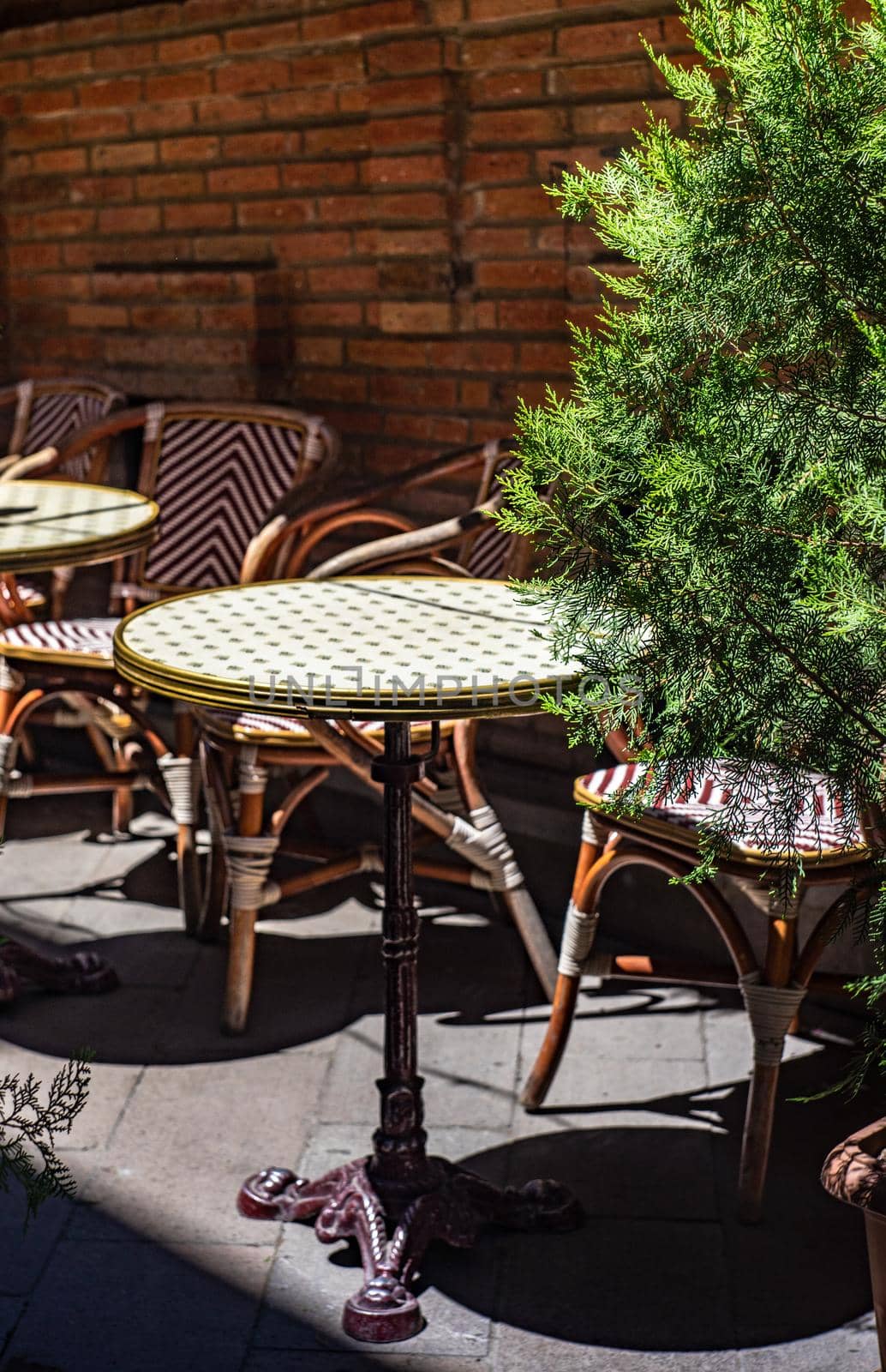 Outdoor cafe with tiny table and chairs in the oldest part of Tbilisi, capital city of Georgia