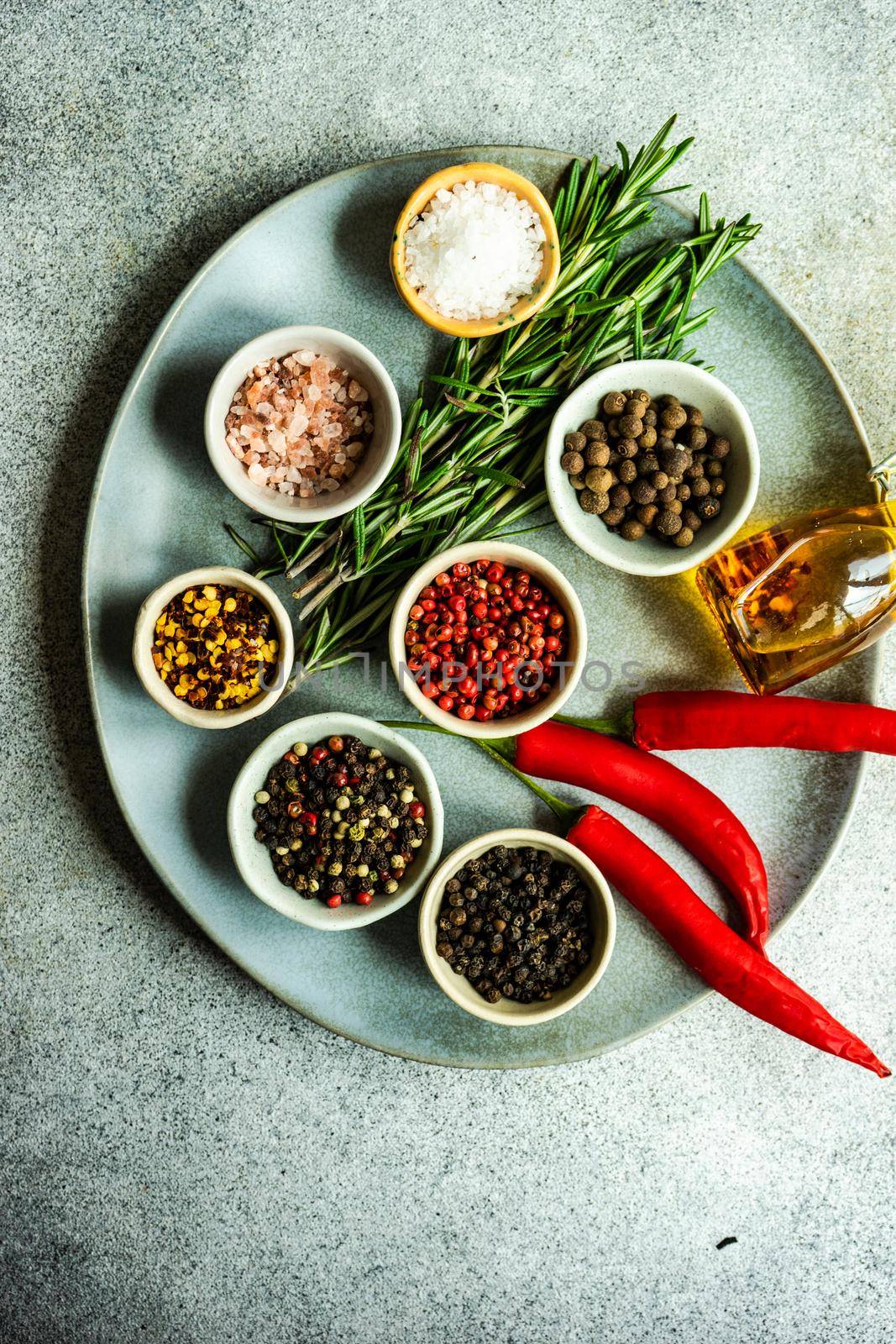 Plate with spices as a cooking concept on concrete table