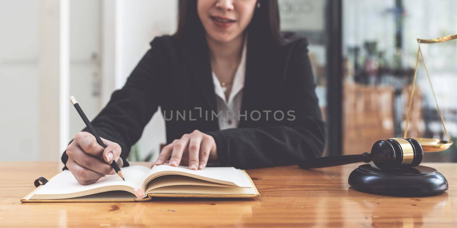 Business woman working or reading lawbook in office workplace for consultant lawyer concept