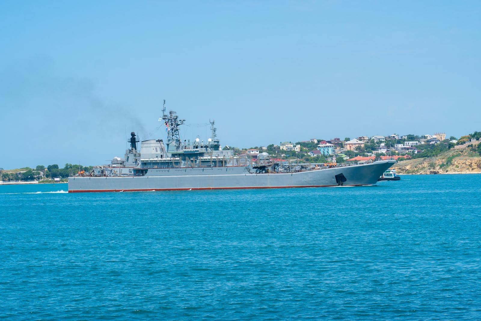 RUSSIA, CRIMEA - JUL 08, 2022: Russian navy military russia group sevastopol day sky city battleship, for black ship for battle for harbor transportation, security defense. Technology steel metal,