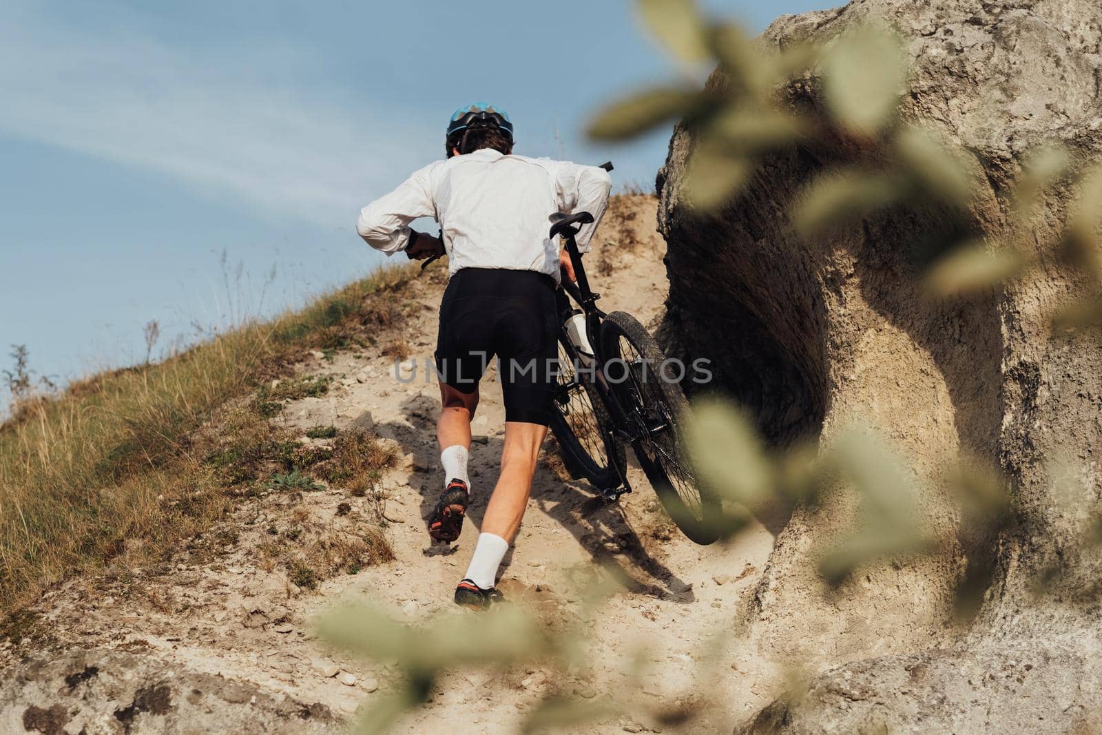 Professional Male Cyclist Carrying His Bike on Top of Hill, Adult Sportsman on Trail