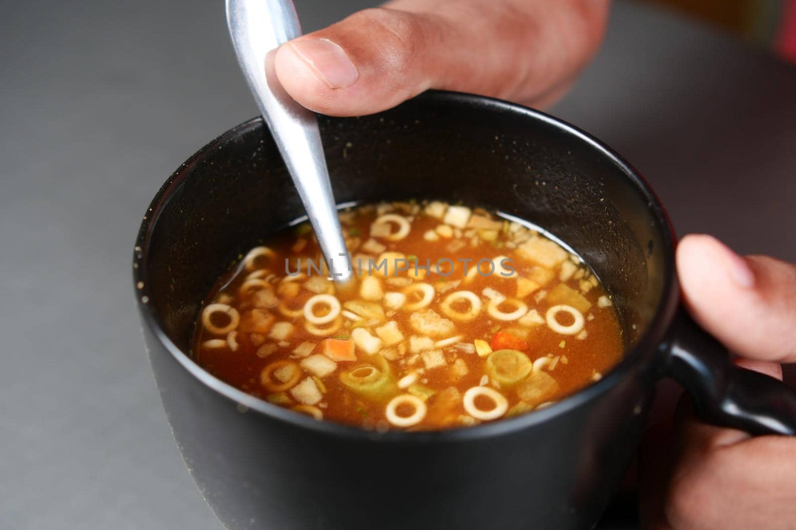 instant cup soup in a mug on table .