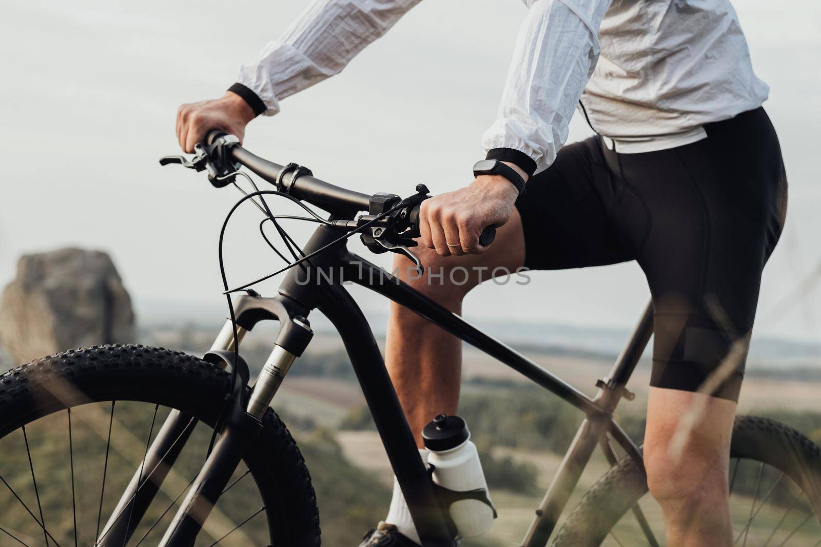 Cropped Unrecognizable Professional Male Cyclist Sitting on Bike Outdoors, Sportsman Riding on Trail Track