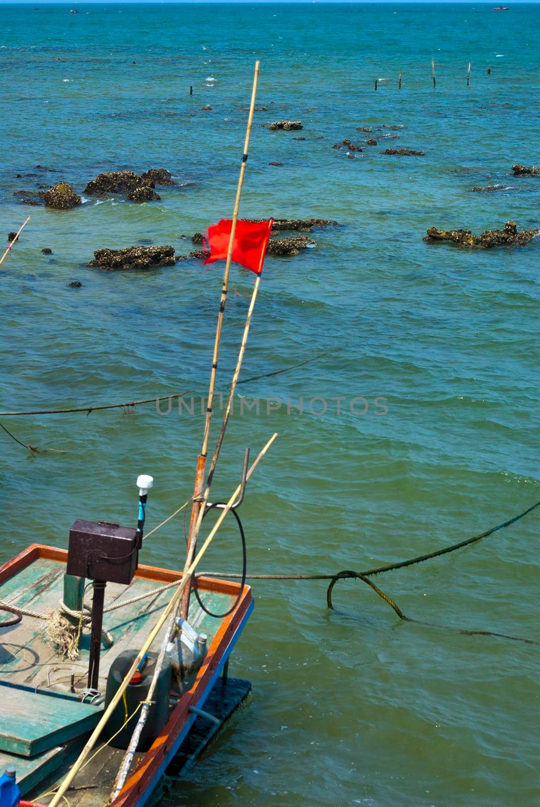 Small Wooden fishing boat coastal drift after returning from fishing