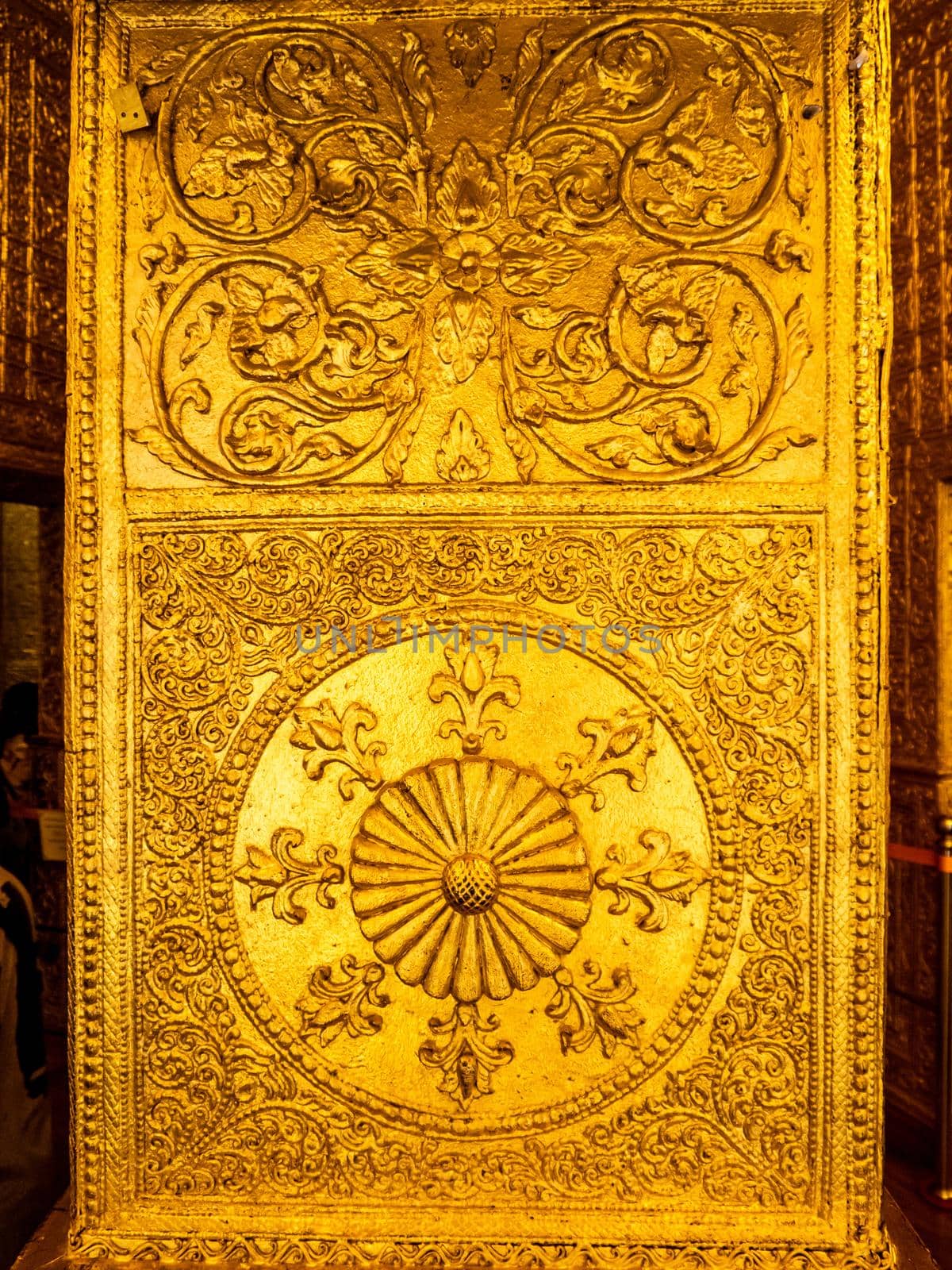 Beautiful Burmese art pattern motifs decorative design on the golden walls of the rooms in the temple