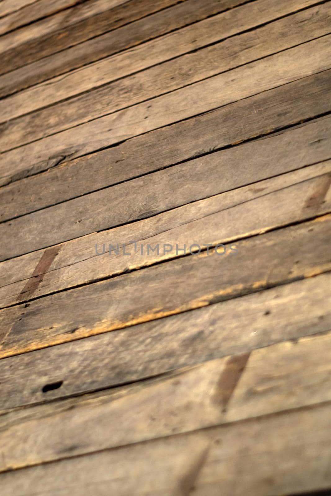 Old wooden planks stacked together to form the walls of the room