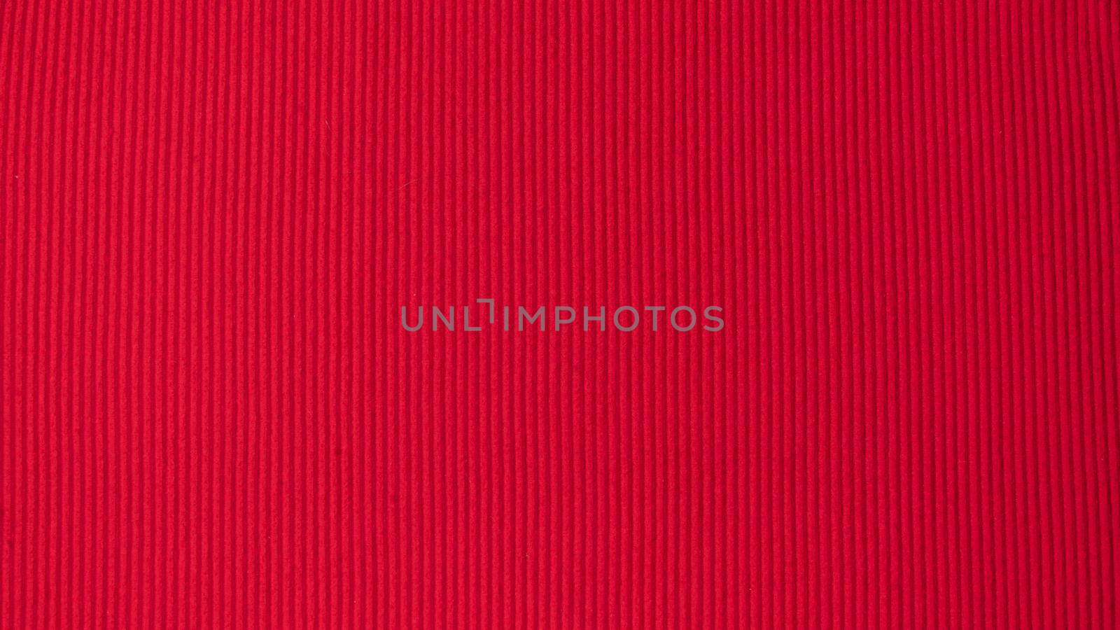 Red textured background with vertical stripes of furrows by voktybre