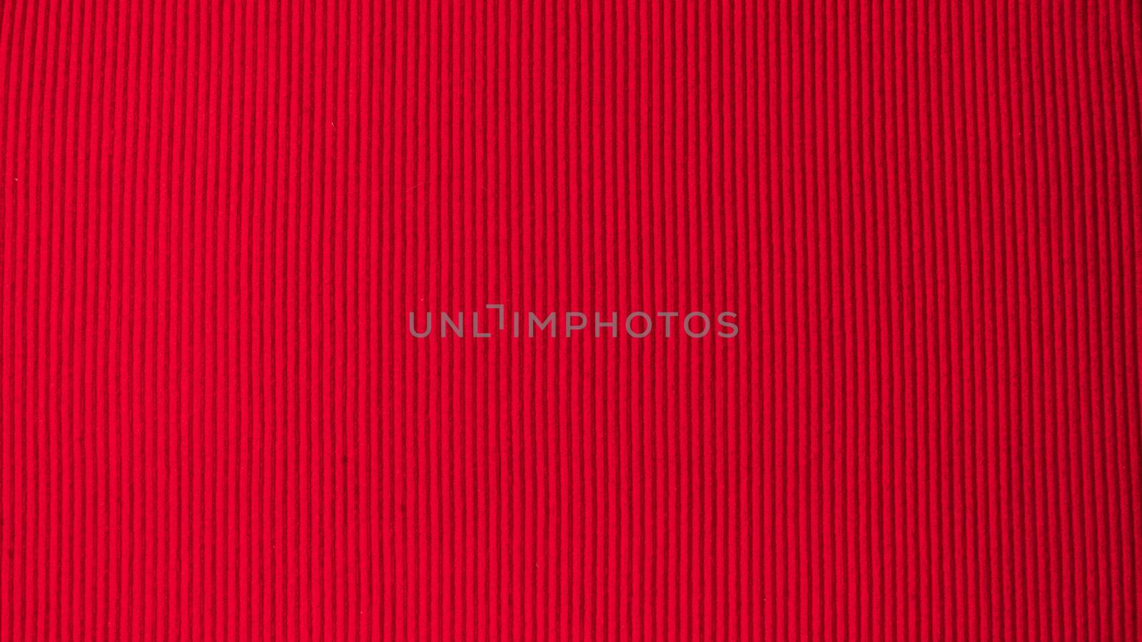 Bright red saturated background in volumetric strip fabric textile by voktybre
