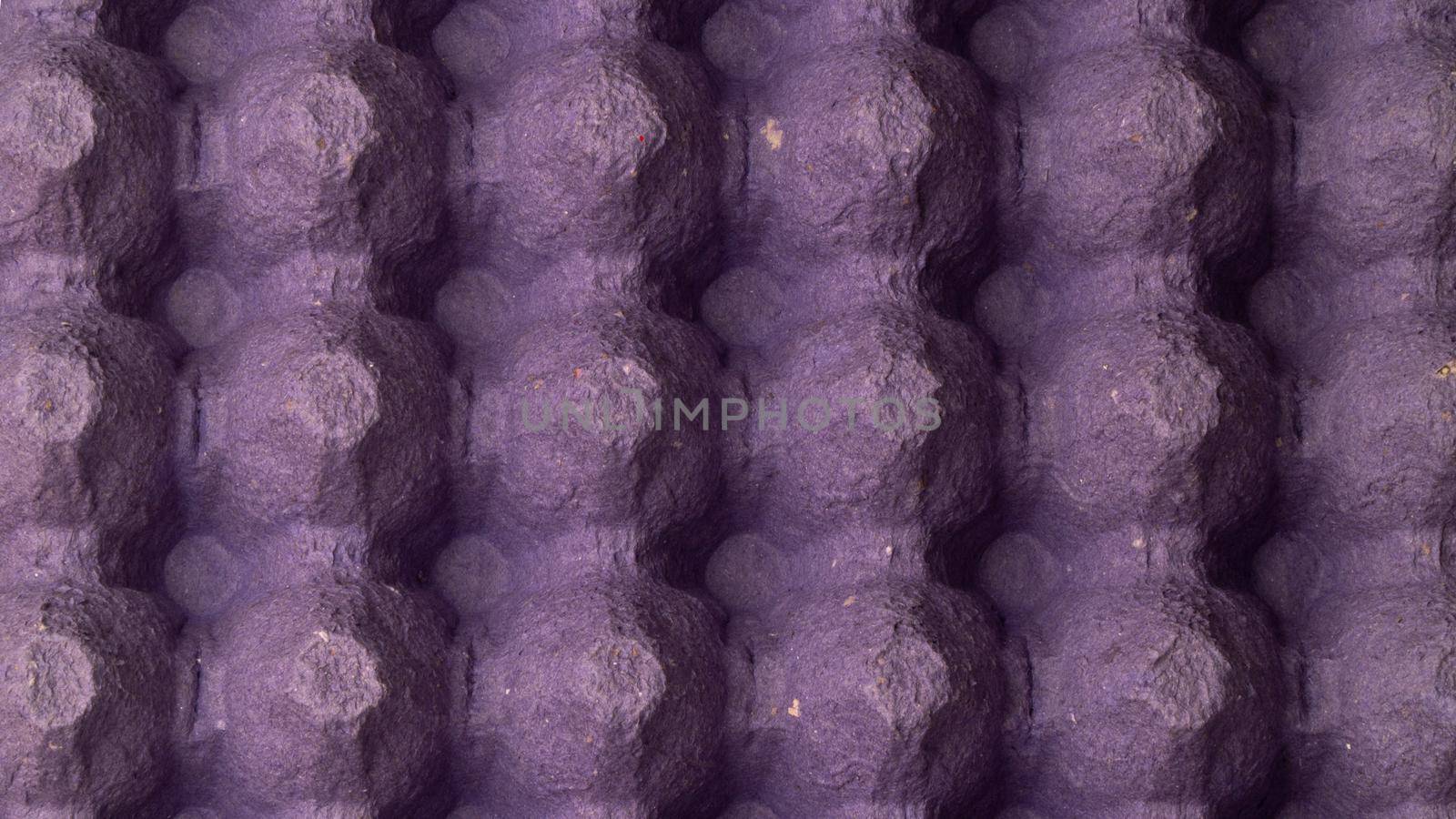close-up egg lattice rack background three-dimensional pattern with bulges purple