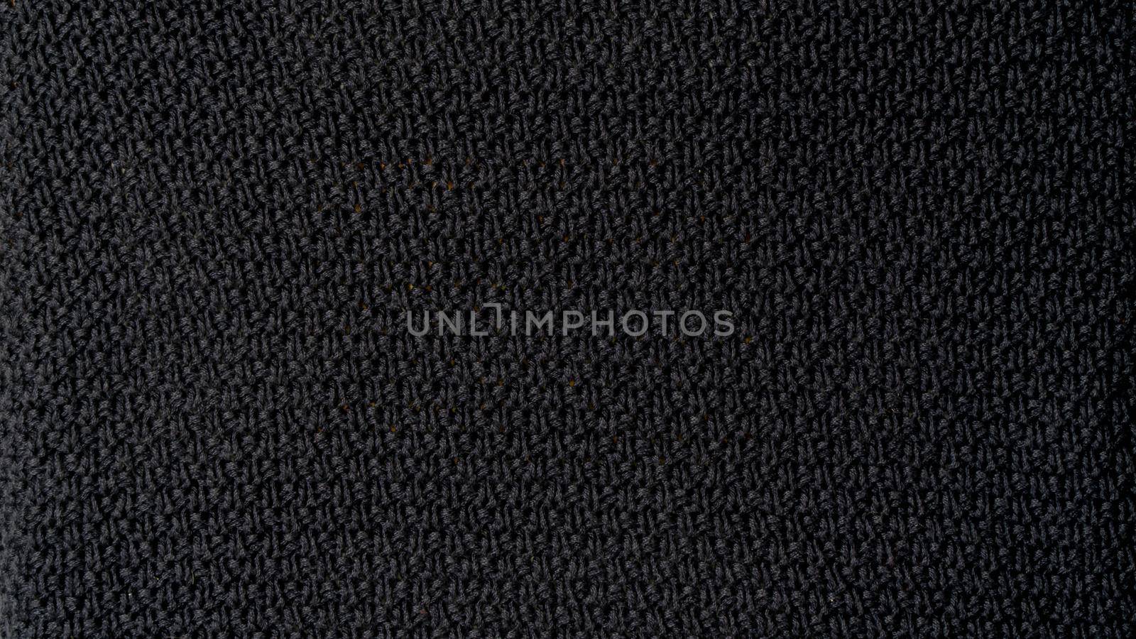 Dark background textile texture knitting weaving. High quality photo