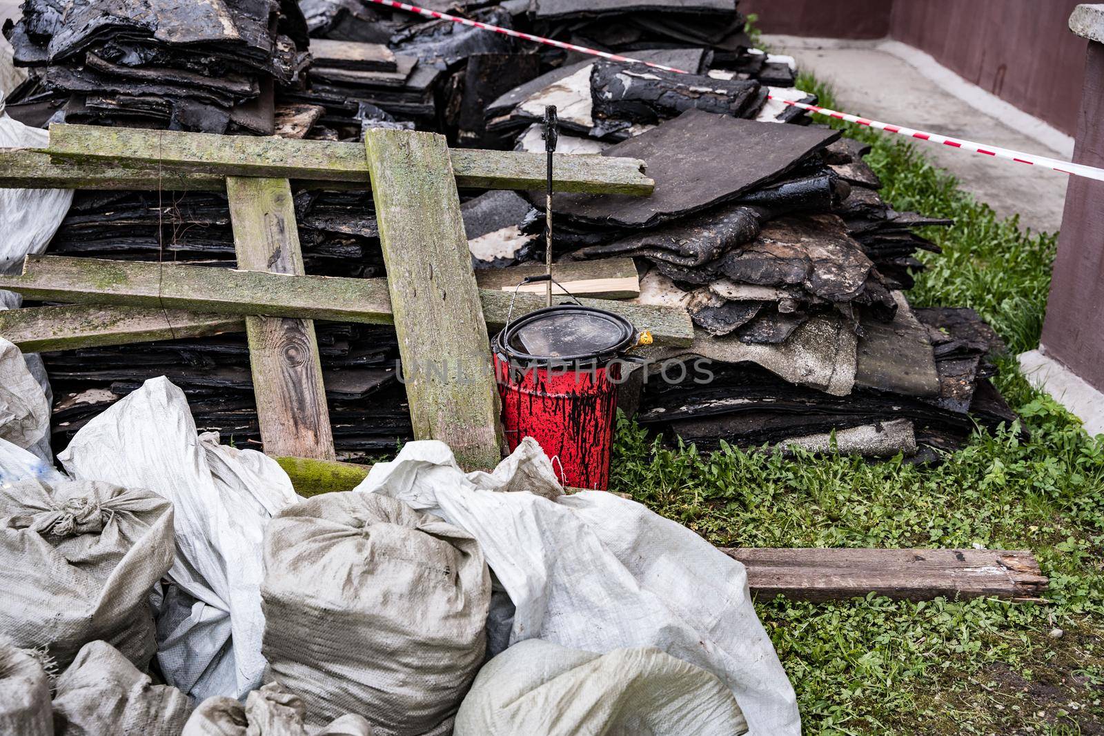 debris left after the repair of the roof. red bucket with mastic by audiznam2609