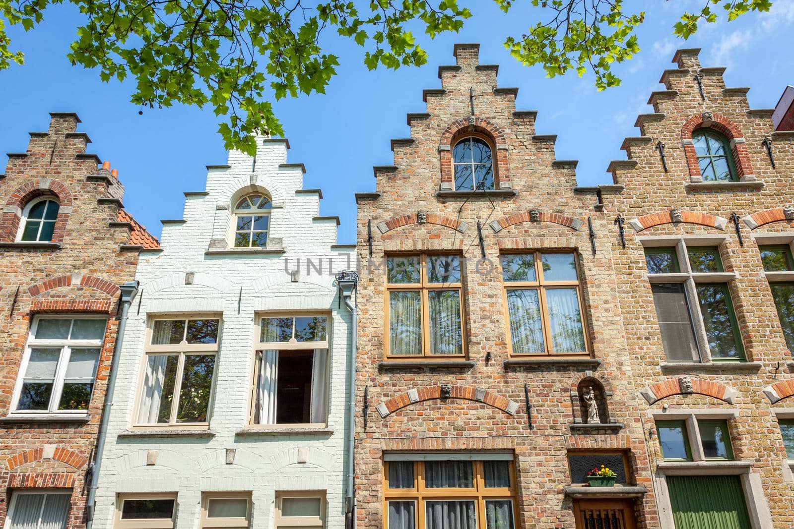 Bruges flemish architecture building facades at sunny day, Belgium