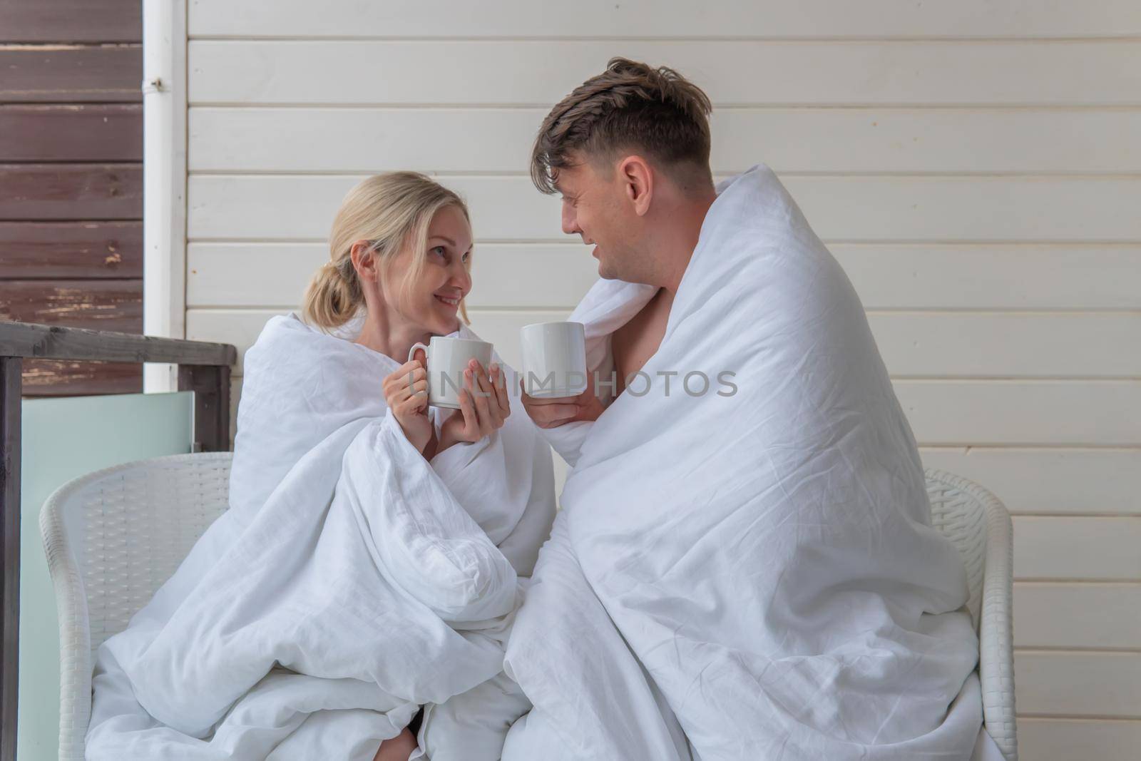 Happy blanket couple girl guy drink cute married young family, for adult love in romance for lifestyle husband, bedroom affection. Closeness wife tenderness,