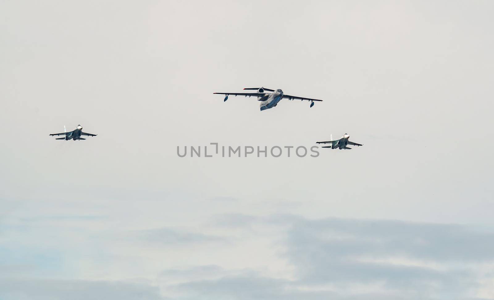 Russia, St. Petersburg, 28 July 2022: Military aircraft and helicopters of the air force fly on the city at the celebration of the Day of the Navy, amphibious and transport aircraft, anti-submarine. High quality photo