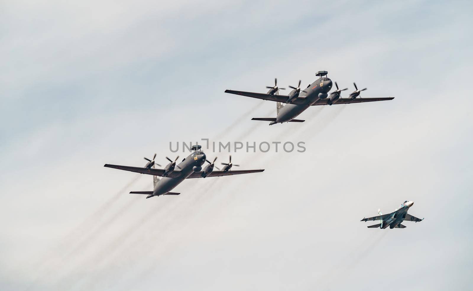 Russia, St. Petersburg, 28 July 2022: Military aircraft and helicopters of the air force fly on the city at the celebration of the Day of the Navy, amphibious and transport aircraft, anti-submarine. High quality photo