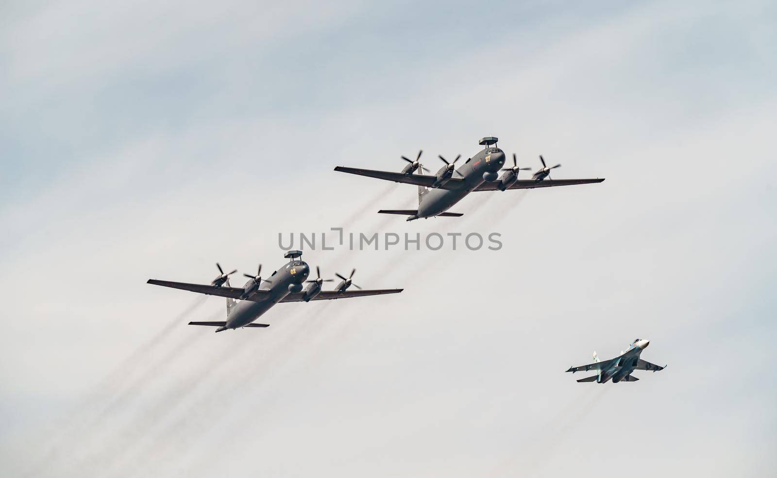 Russia, St. Petersburg, 28 July 2022: Military aircraft and helicopters of the air force fly on the city at the celebration of the Day of the Navy, amphibious and transport aircraft, anti-submarine. High quality photo