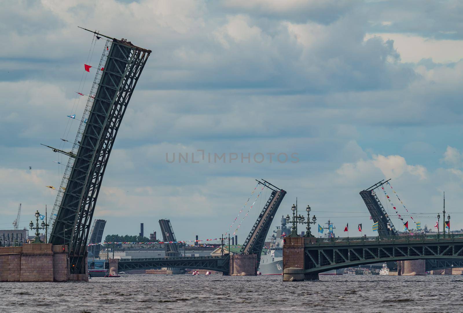 Russia, St. Petersburg, 28 July 2022: The Trinity Bridge is being opened for the passage of military corpables during the afternoon dress rehearsal of the celebration of the Day of the Navy. High quality photo