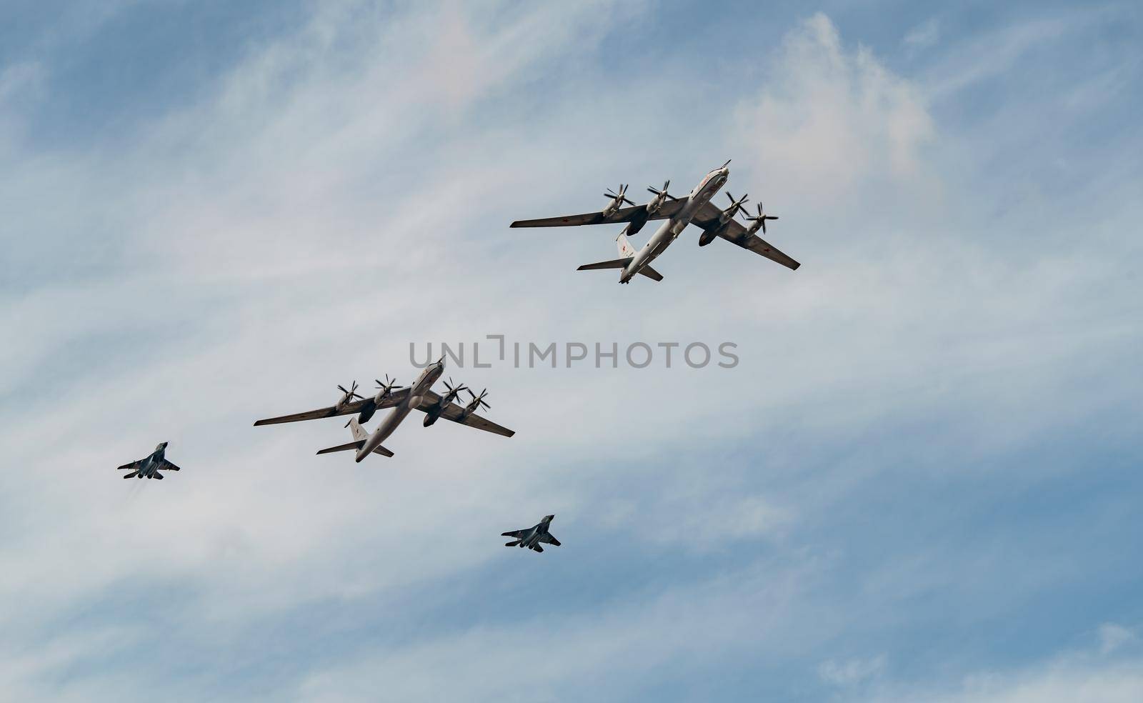 Russia, St. Petersburg, 28 July 2022: Military aircraft and helicopters of the air force fly on the city at the celebration of the Day of the Navy, amphibious and transport aircraft, anti-submarine. High quality photo
