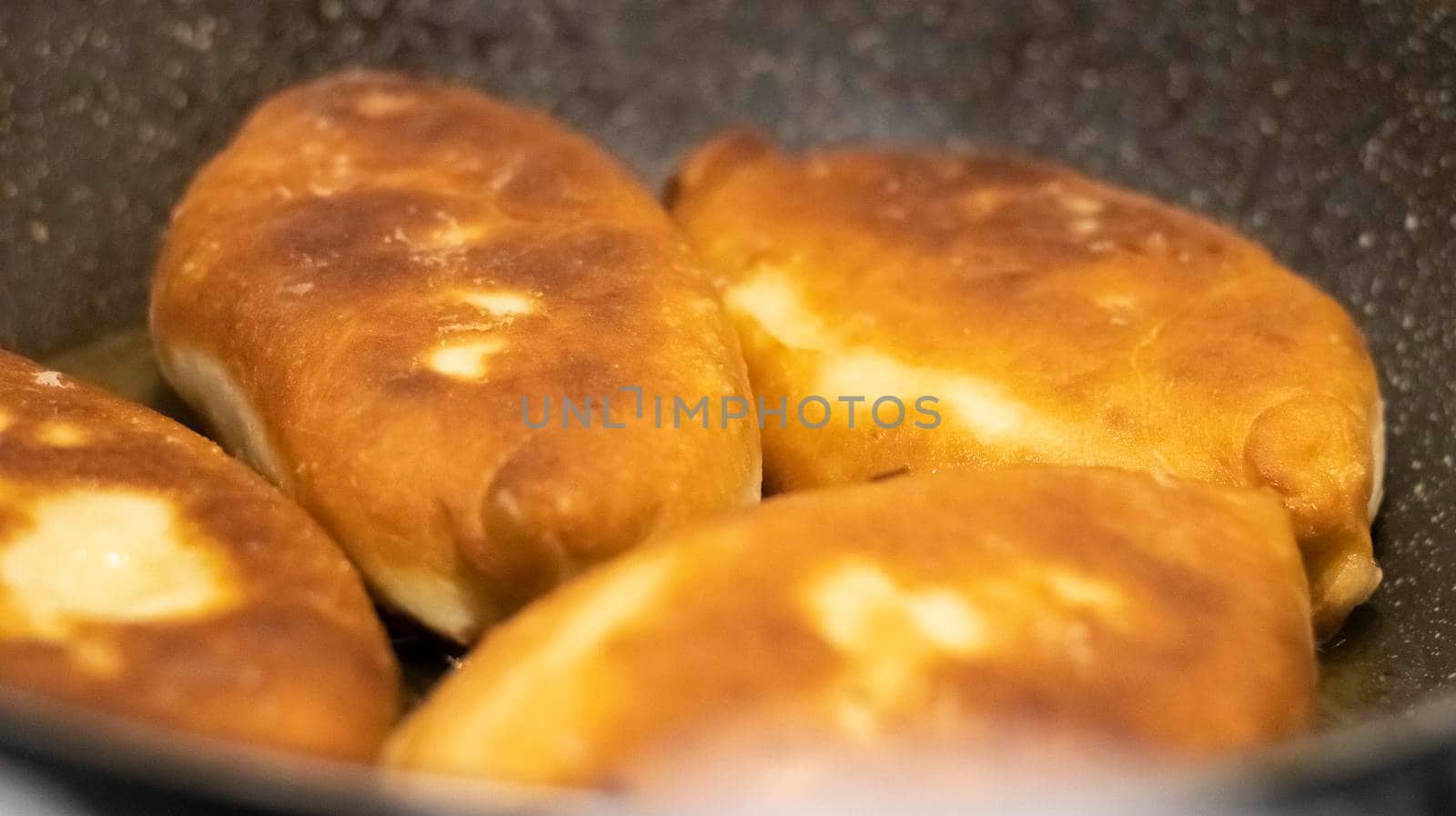 Appetizing savory fried pies. Traditional fresh, freshly made homemade stuffed pies, also known as pastel. Rustic fried yeast dough pies