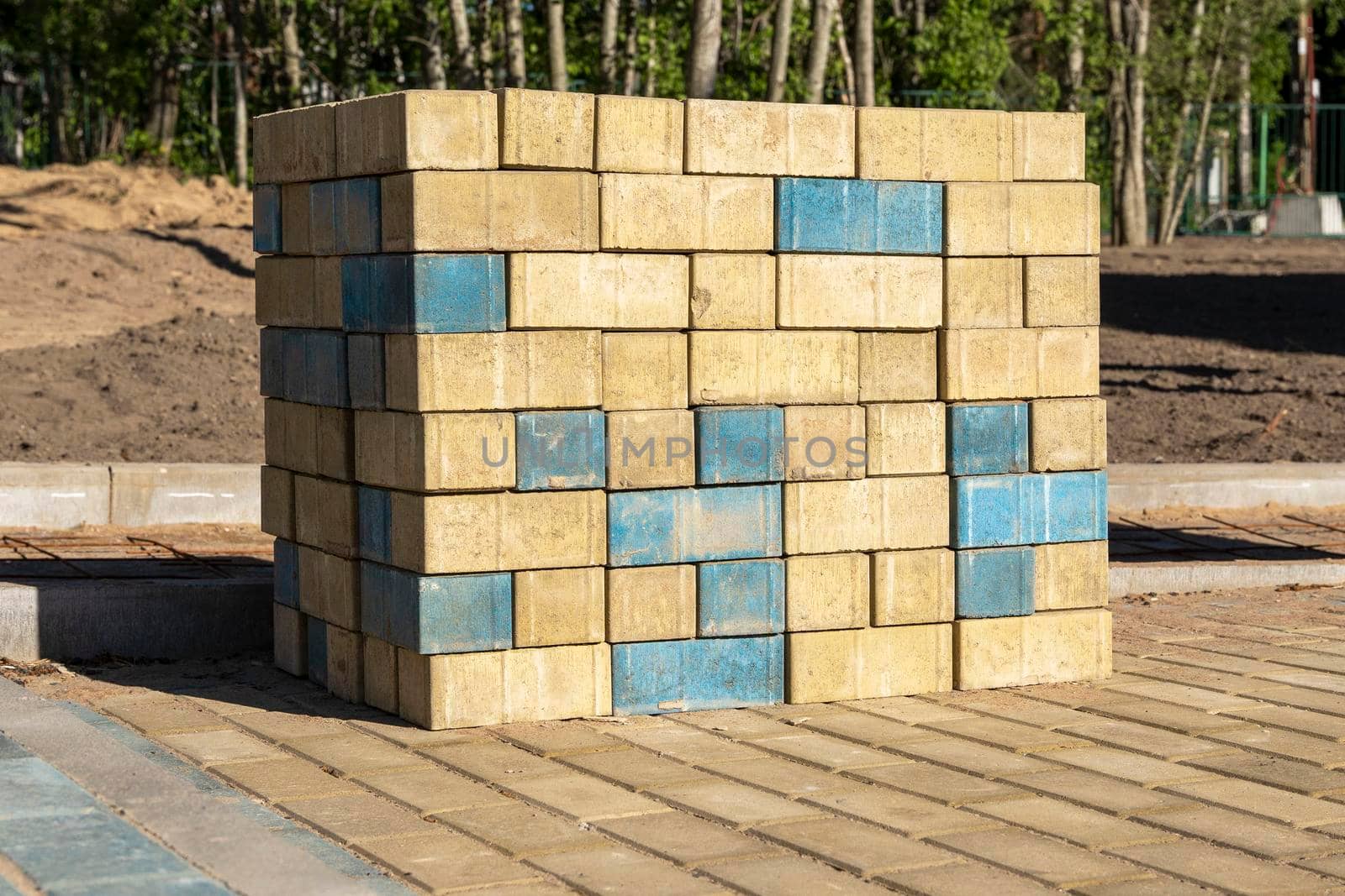 stacks of paving slabs for paving paths stacked on a construction site by audiznam2609