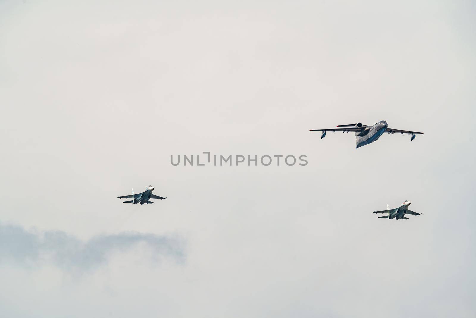Russia, St. Petersburg, 28 July 2022: Military aircraft and helicopters of the air force fly on the city at the celebration of the Day of the Navy, amphibious and transport aircraft, anti-submarine. High quality photo