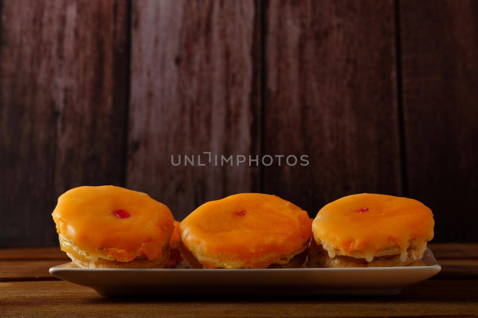 tortas locas, crazy cake typical from andalucia spain on a blue plate on a wooden background