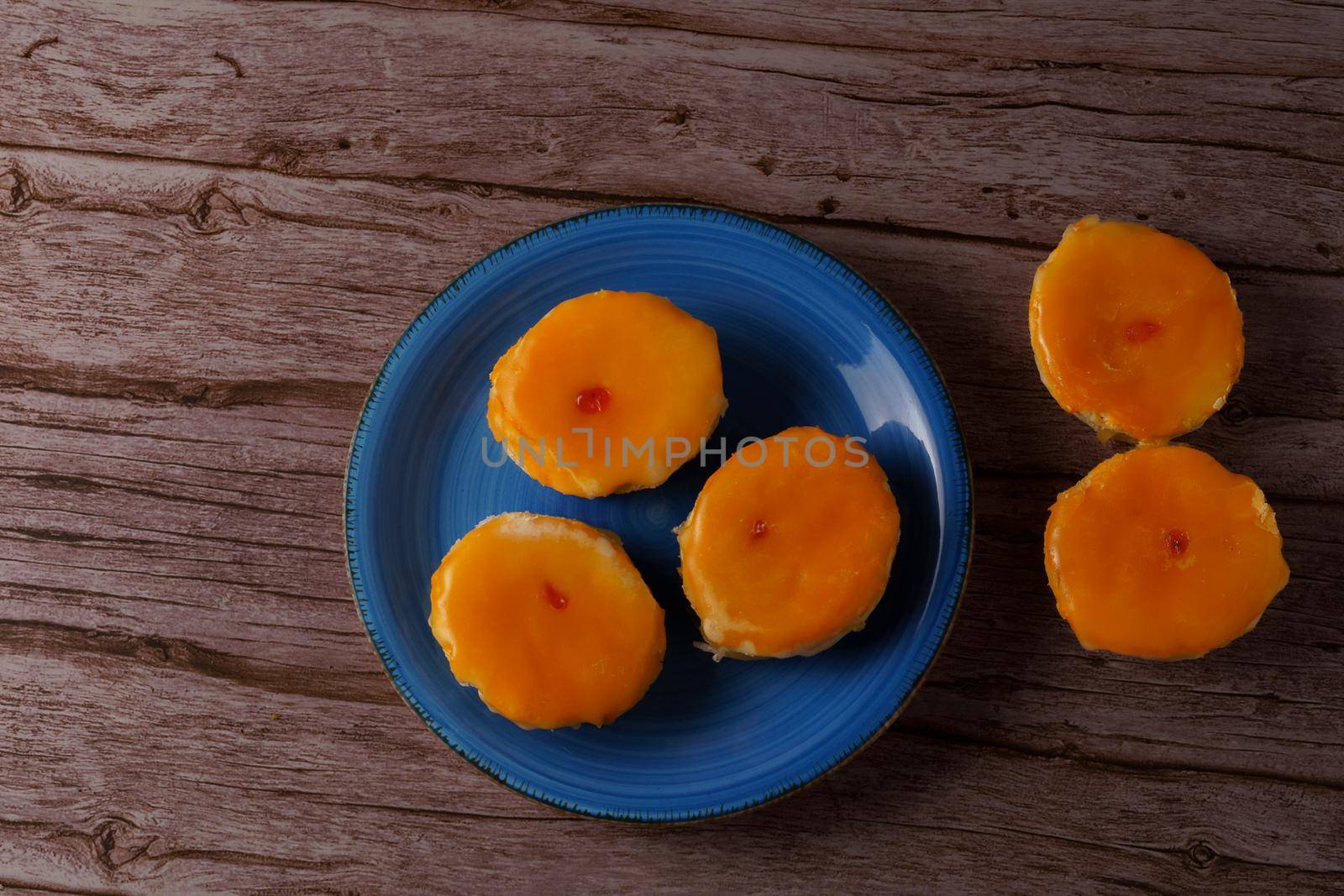 tortas locas, crazy cake typical from andalucia spain on a blue plate on a wooden background